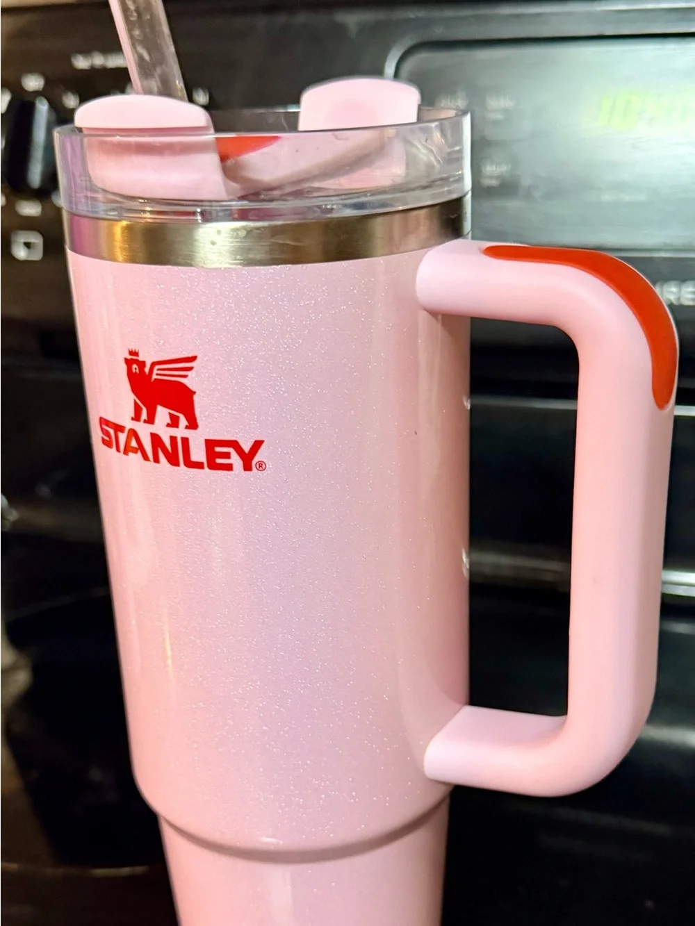 Stanley Sparkling Light Pink Travel Mug with Red Logo and Handle Accent